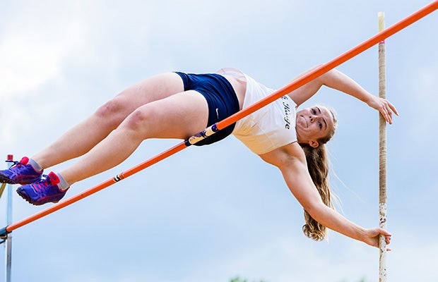 An Oak Ridge (Calif.) pole vaulter soars during a Sierra Foothill League meet against Nevada Union.