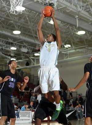 Poly's 6-3, 200-pound senior guard Chris
Sullivan soars in for two of his 12 points.