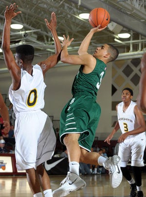 De La Salle's Justin Hill (3) gets a shot
over Columbia Christian's Israel Hammond.