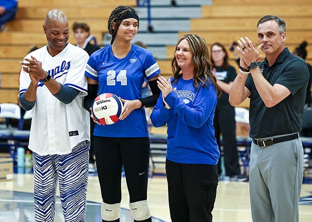 Flanked here by parents Lawrence and Christi along with Hamilton Southeastern coach Jason Young (right), Harden pounded 371 kills this season. (Photo: Kent Graham)