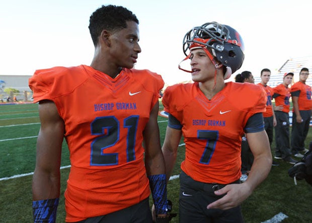 Cordell Broadus (left), son of Snoop Dogg, and Biaggio Walsh, grandson of Muhammad Ali, enjoy a short conversation before their first varsity game at Bishop Gorman. Broadus, a senior, transferred from Diamond Bar (Calif.). Walsh, a sophomore, played on the freshman team last season.