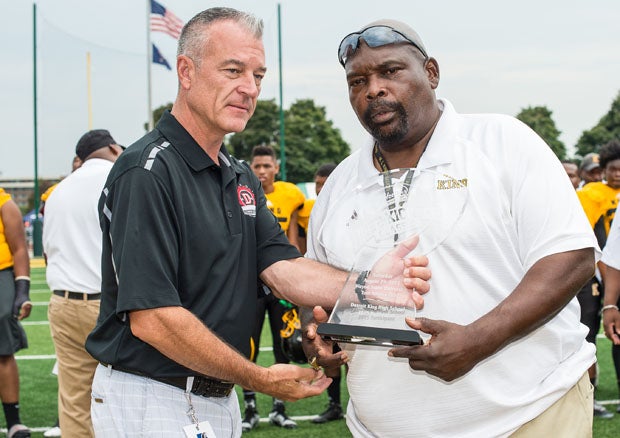 King legendary football coach Dale Harvel (right), accepting an award last fall, collapsed and died during a 7-on-7 game on Friday.