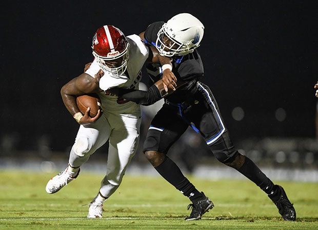 IMG defensive back Kamari Wilson brings down an Edgewater player.