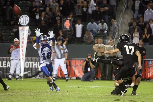 Servite senior kicker Nicholas Echeverry delivers the game-winning field goal. 
