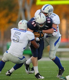Marcus Grandison (5) was in on
this tag team tackle.