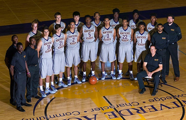 Monverde Academy head coach Kevin Boyle (seated) is shown with his players and coaches.