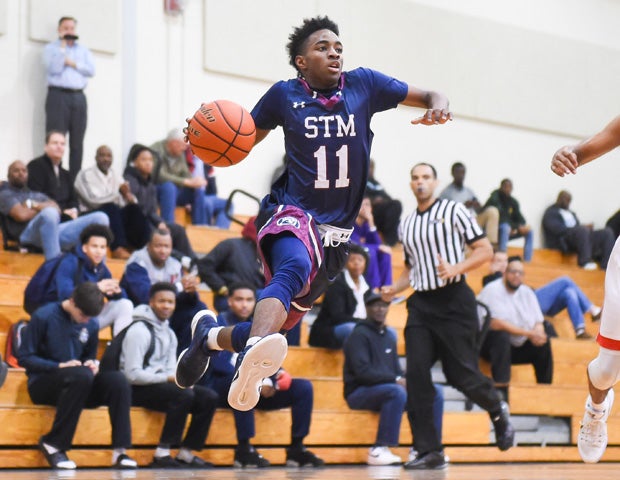 A St. Thomas More (La.) player soars to the basket during a game in the Metairie Park Country Day Holiday Tournament.