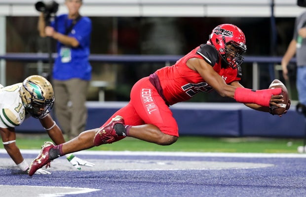 Cedar Hill (Texas) receiver Cameron Buckley scores on a diving touchdown catch during the UIL 6A Division II regional title game at AT&T Stadium.