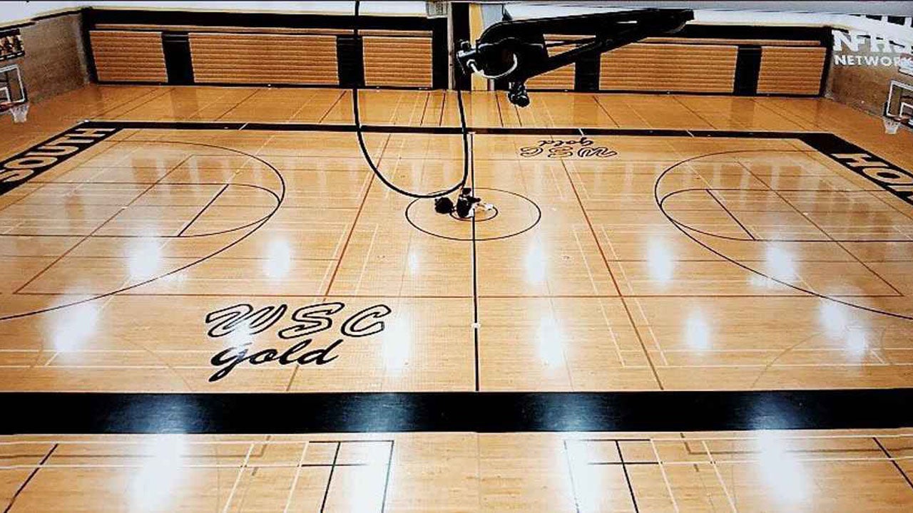 The shot that went viral: Billy Durkin alone with his thoughts at midcourt after Hinsdale South's season ended due to the coronavirus pandemic.