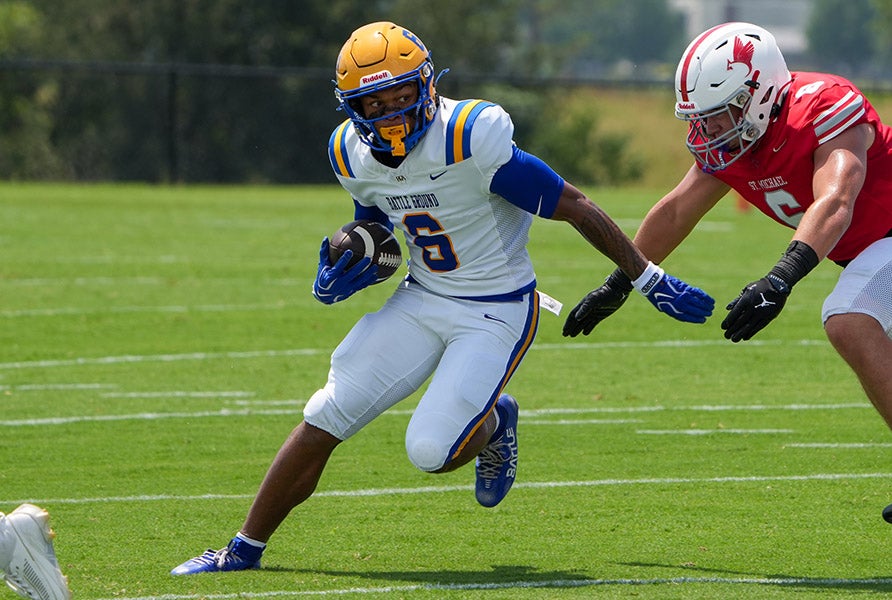 Max Curry evades a tackler Saturday in Battle Ground Academy's win over St. Michael Catholic. (PHOTO: Brad Boland)