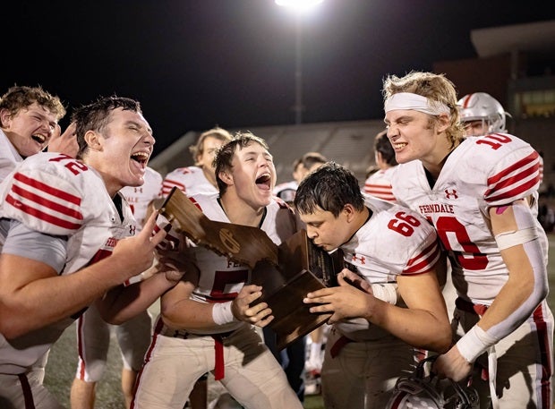 Ferndale players celebrate with their CIF 7-AA trophy after beating Fairfax last weekend. Ferndale native Guy Fieri helped the team with travel costs from the North Coast town to Los Angeles. (Photo: Antoine Belote)