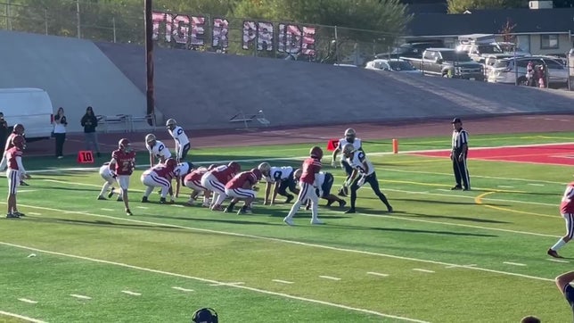 #14 from the NG position finishes of the tackle downfield.