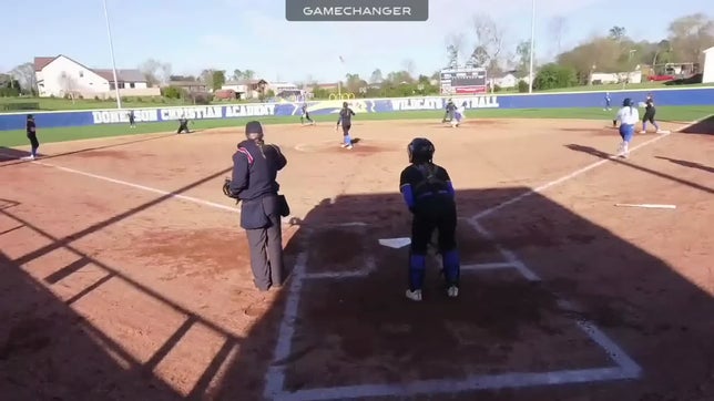 Throwing from her knees to complete the play, McHenry gets the second out to complete the double