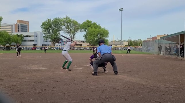 Adelyn hits a towering ball to the fence
