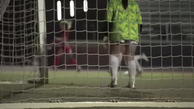Emily Rollins with a cross for the assist