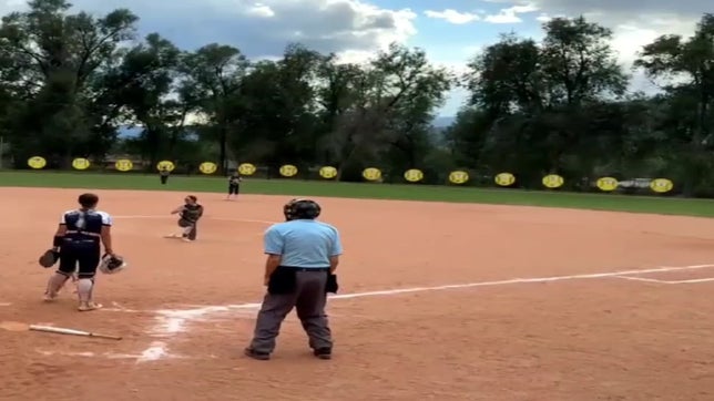 Olivia, the pitcher, made a diving catch on a bunted ball  and threw it to first for a double play.