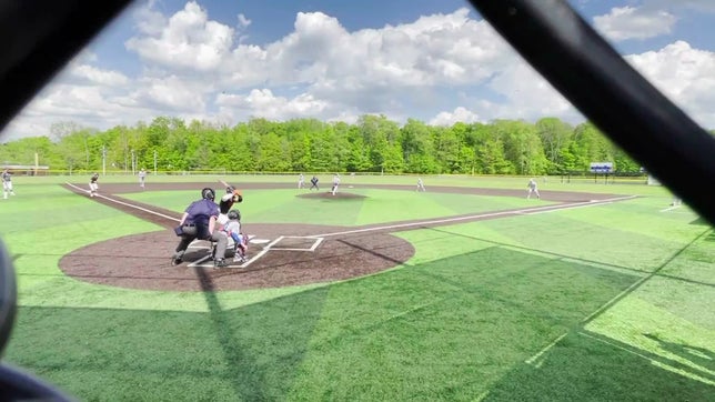 Gilmore makes throw from mid right field to home plate during region game against Harbor Creek.