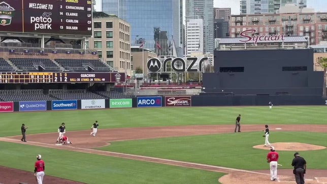 Antonio Amado throws a runner out at 3rd base.