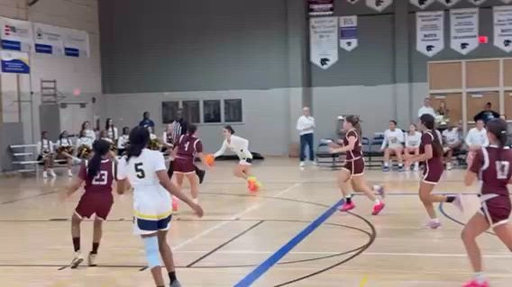 Isabella Clarke (Sophomore) dribbles and goes the a layup.