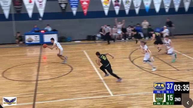 A steal and subsequent fast break result in Ian McGarry jamming home his first high school dunk.