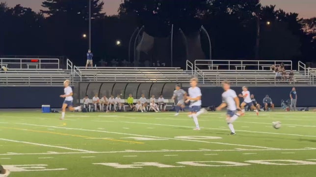 Freshman goalkeeper Brady Payne makes a one-handed save against Warren Central
