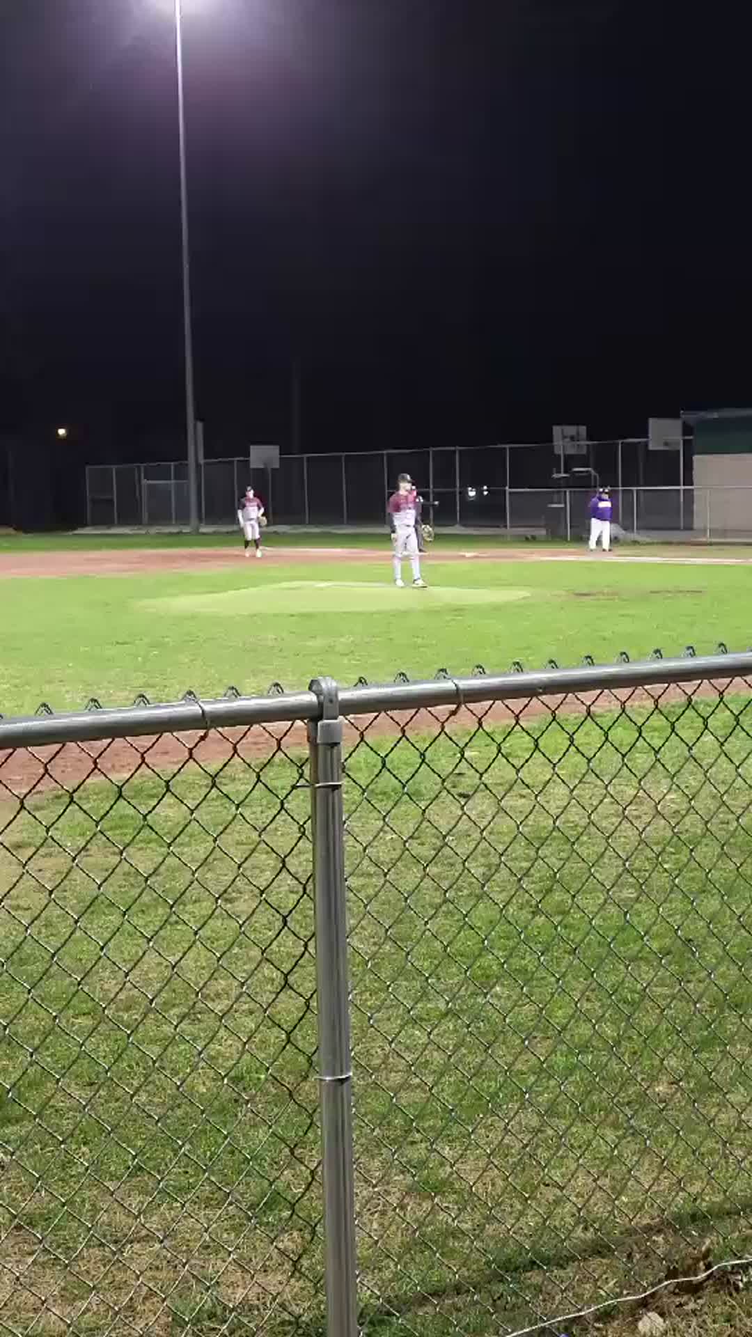 pitching in first Varsity game