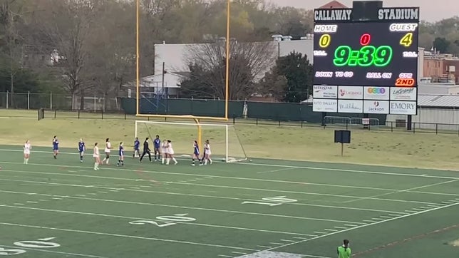 Senior Chloe Roberts scores on senior Sarah Zidar's corner kick.