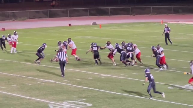 Shadow Hills Middle Linebacker David Caris takes down Palm Desert running back.
