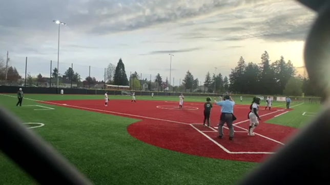 Freshman Annabella Murphy makes a diving play on a ground ball into the 5.5 hole and throws out the hitter from one knee