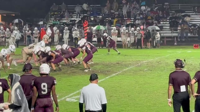 #15 Brady McCullough kicking in the rain