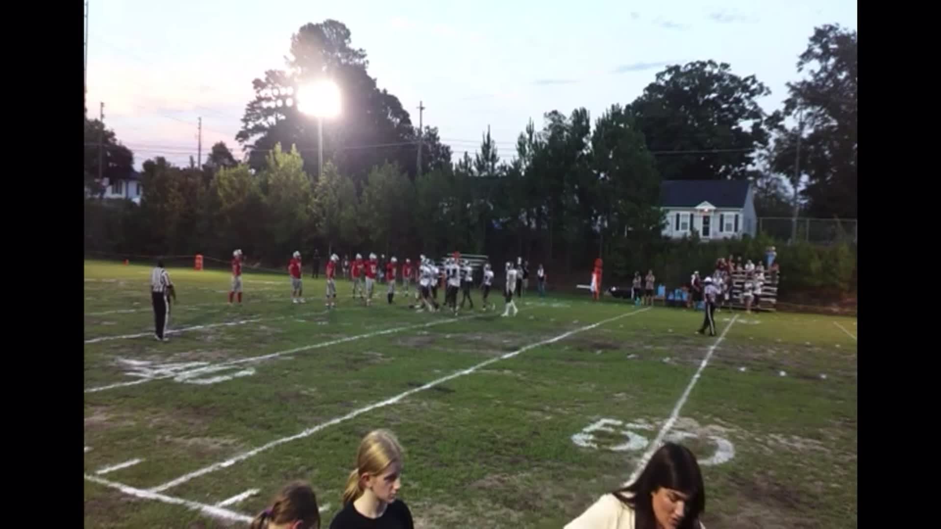 Sophomore Middle LB  Christian Kilpatrick #2  slides out to D-end and waits to read the QB keep to force the fumble