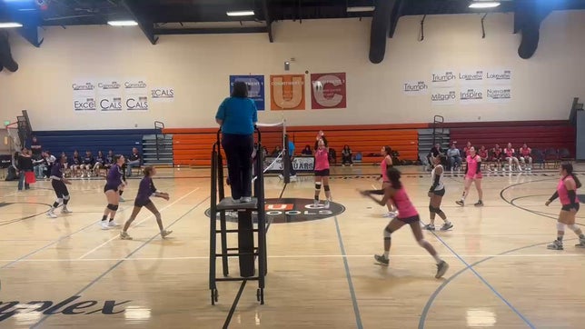 ISABEL HOLOMAN #4 spiking the ball and earning the point for jaguars. Assist from MARISOL SOLIS #10