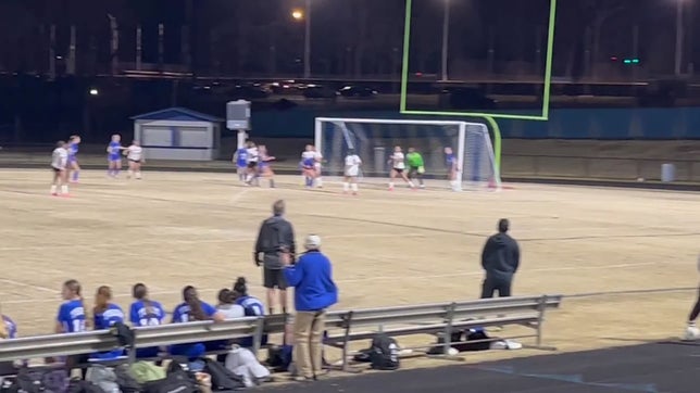 Claire Johnson finds the loose ball, on the corner kick from Caroline Van Thillo, & connects