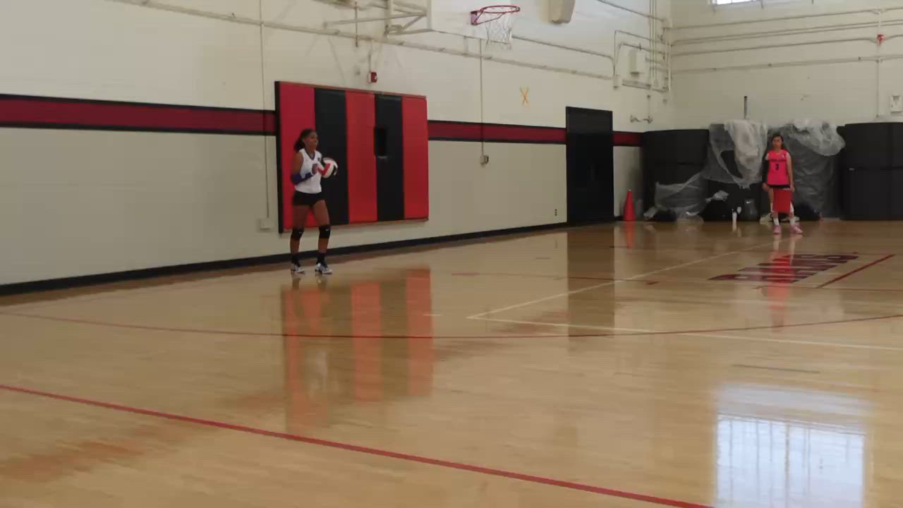 ARIANNA HOLOMAN scoring an ace for jaguars