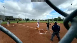 Freshman Annabella Murphy drives a triple into the left center gap off against Ida B Well Pitcher, Sam Stevens