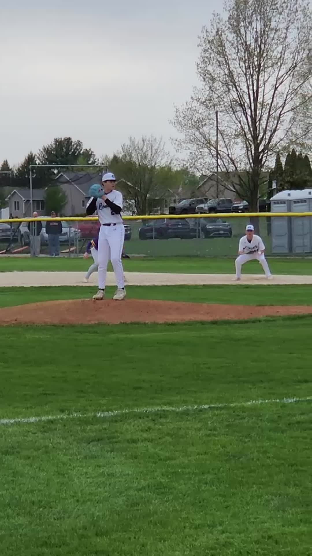 Pitching varsity Newman Comets