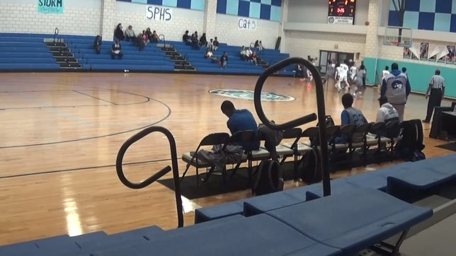 E'miray Fletcher#14 passes to Jahavon Grows#34 down at the free throw line for a shot.