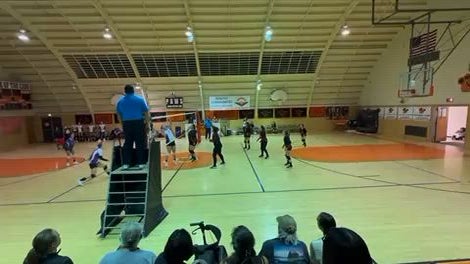 Avygnon dives and saves the ball sending it back over the net.