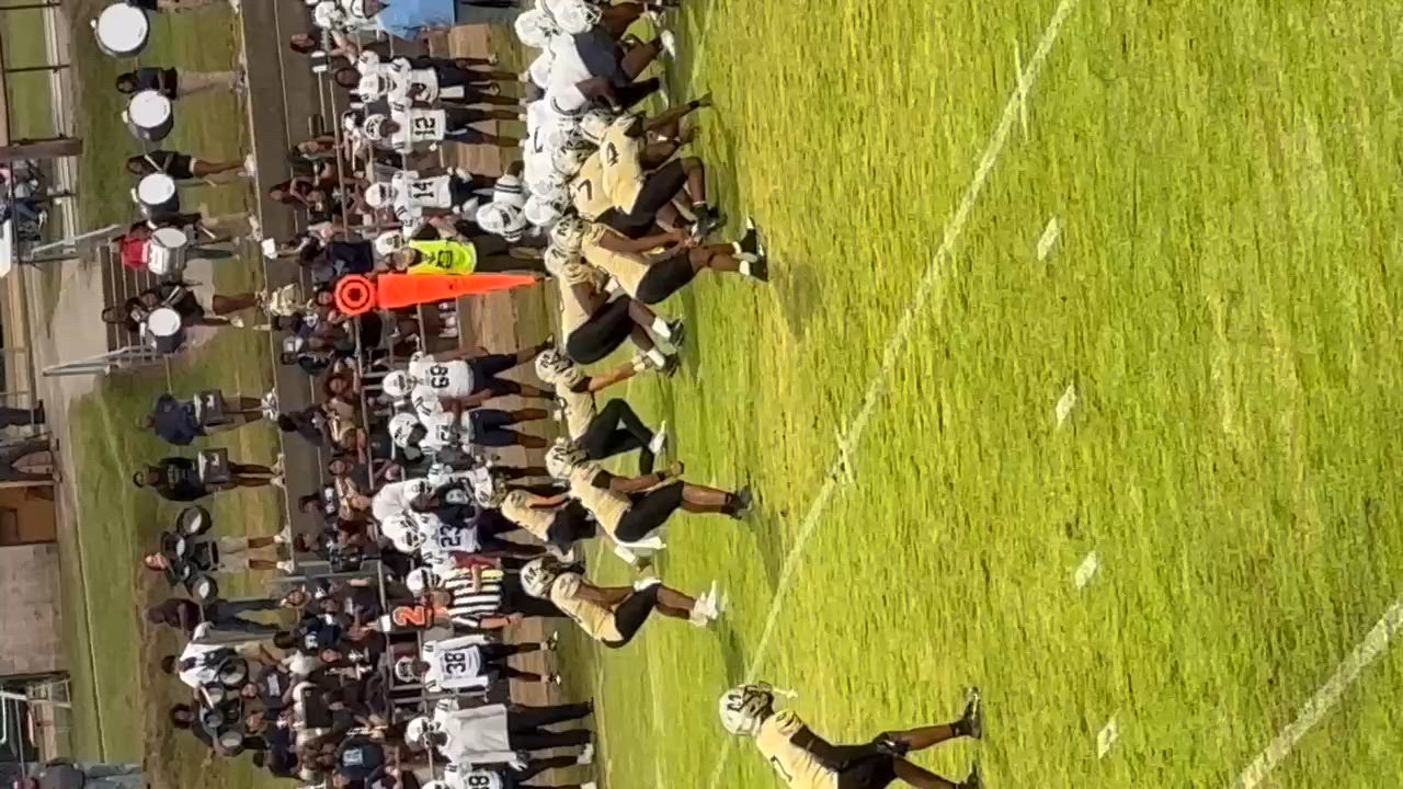 Number 52 stripping the ball and getting the recovery