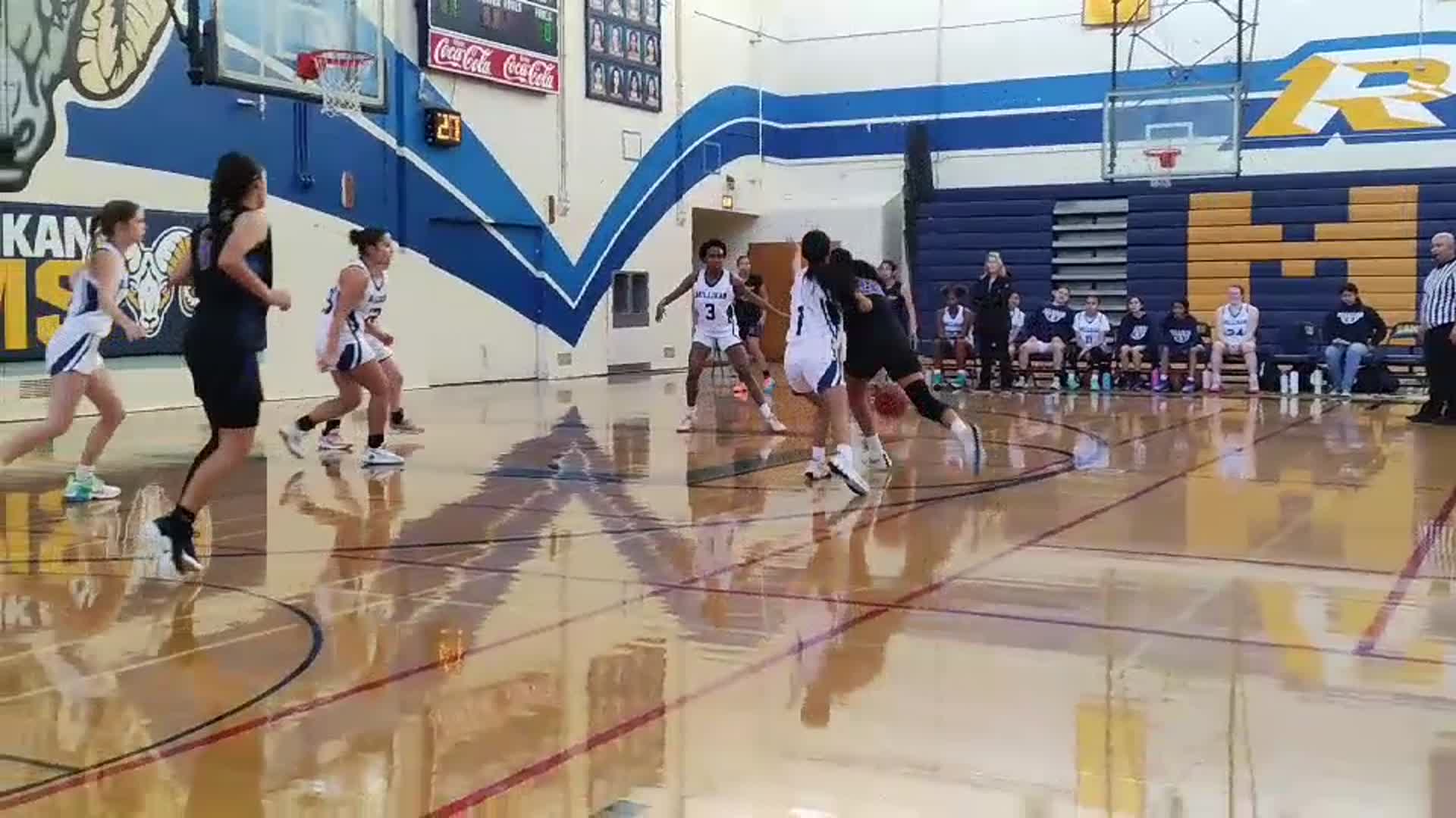 Lady Lions hooping against Millikan High School