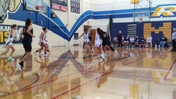 Lady Lions hooping against Millikan High School