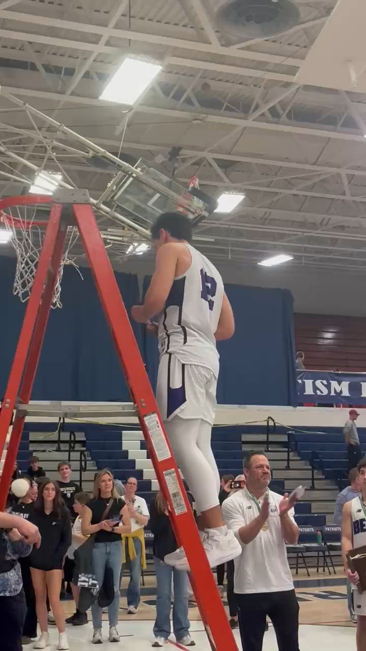 Antonio Escano and Lincoln Lee cut down the nets after DISTRICT CHAMPIONSHIP WIN!