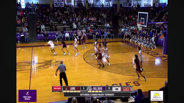 Cayden young Harrisburg High School bulldogs basketball senior stealing the ball out of the opponents hands, drives it down, and makes a two pointer