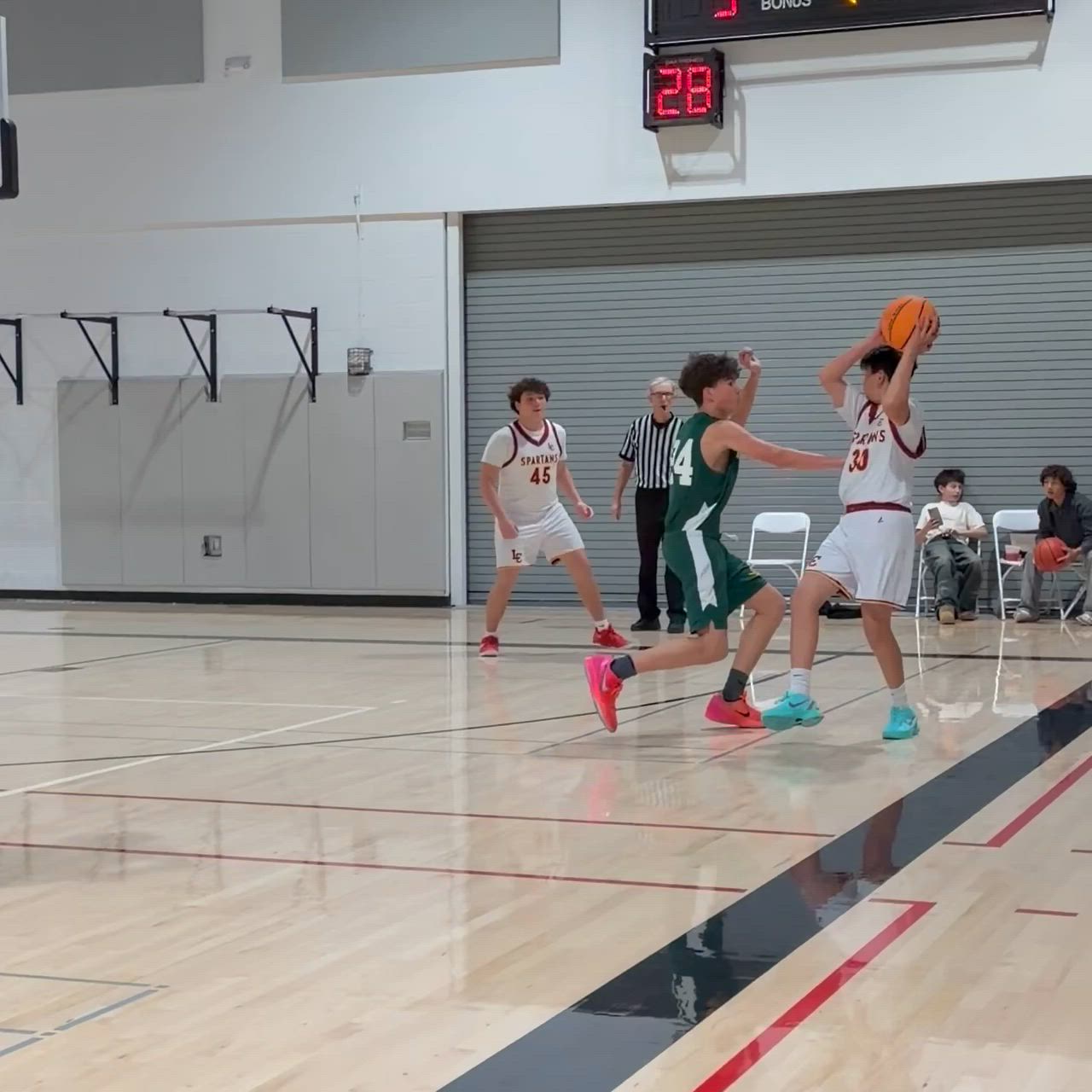 Abel Arana (3) with the block and assist. Holden Levy (2) with the basket.