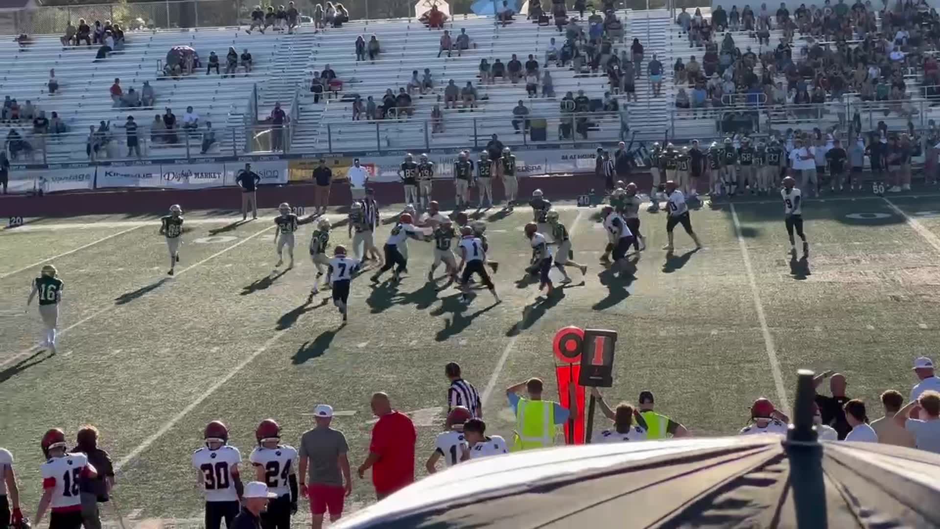 Tigers QB #9 Tama-Satoa Numera hand off to #21 Carver VanValkenburg for a gain in yards