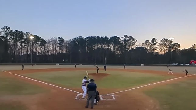 Eli Gentry hitting a home run with two on base