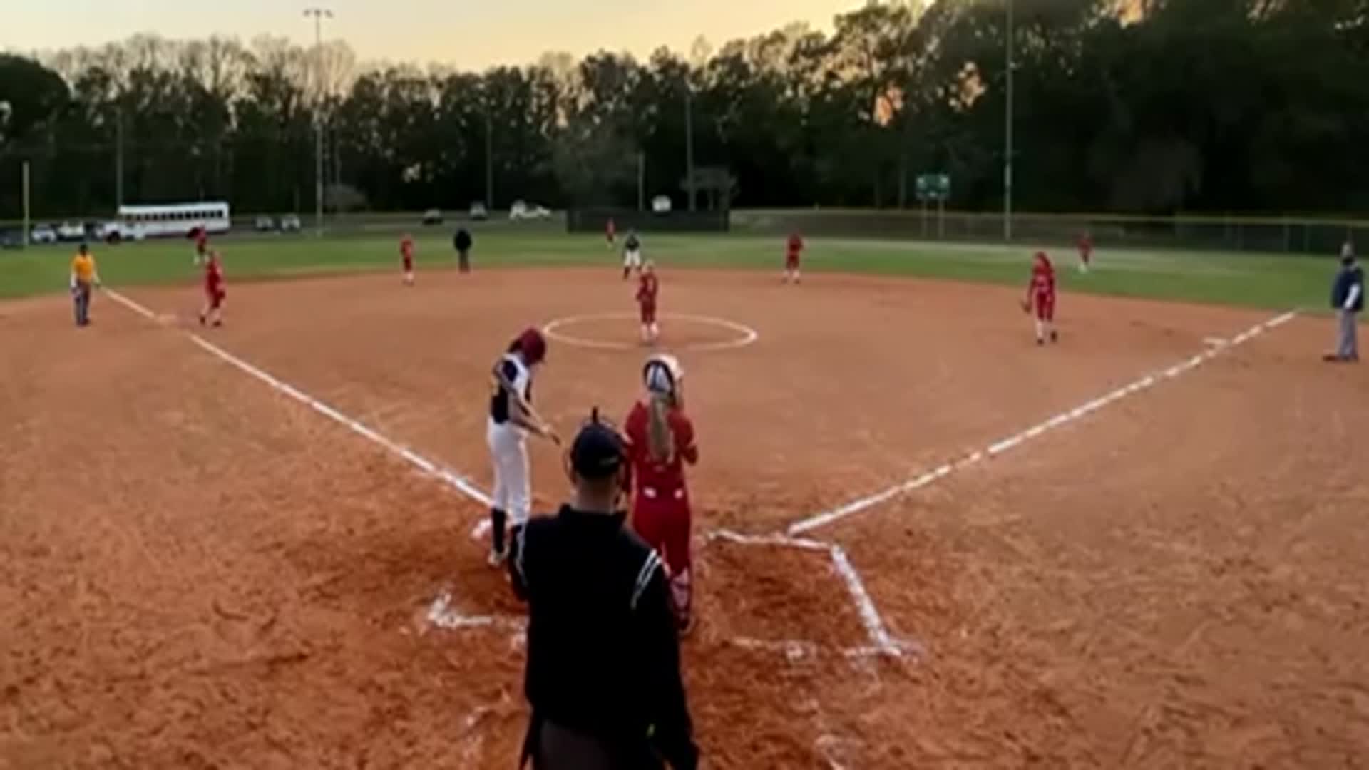 Pitcher, 8th Grader, Addison Pratt Strikes out Murphy High School player for final out of the inning. Emily Crosby catching.