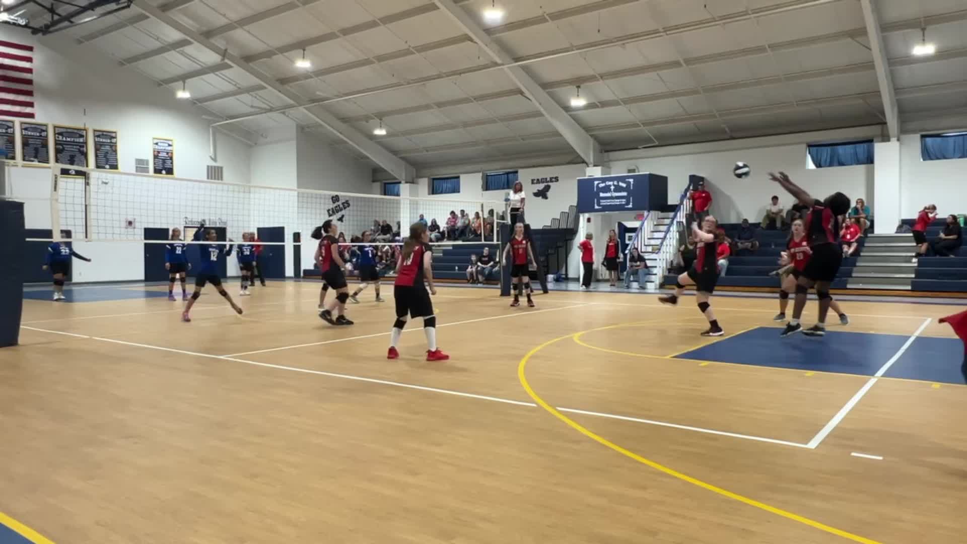 Pass by Tyra Martin (#25), assist by Ashley Belcher (#11), and swing by Mackenzie Belcher (#4)