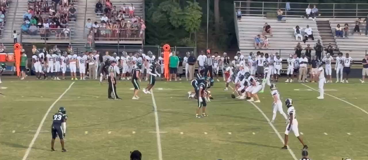 #5 ILB, Derek Schemenauer, and #6 OLB, Gavin Lennon, tackle Heritage RB #41, Brandon Hawkins