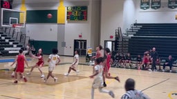 Jaysen Moise catching catching a lob in the game versus Quince Orchard